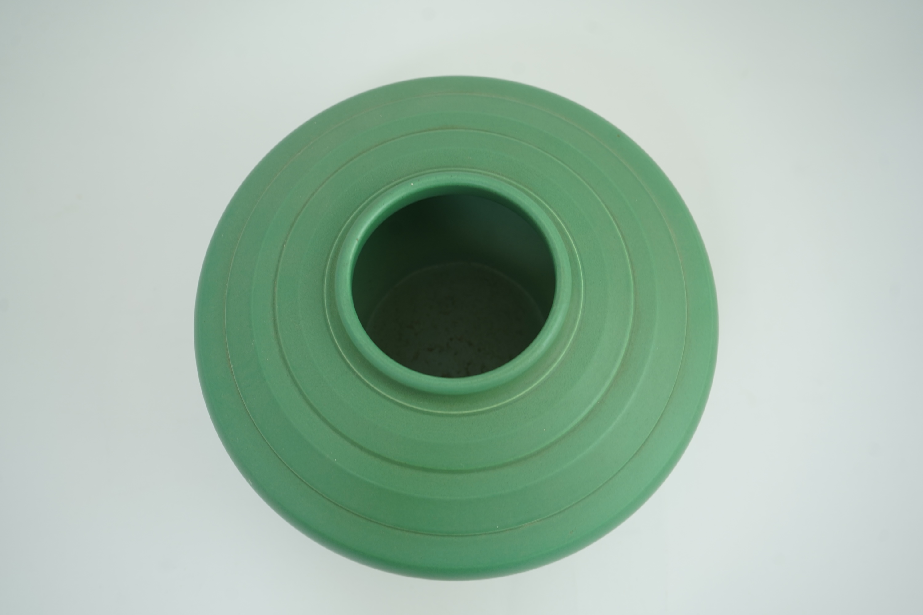Keith Murray MC RDI FRIBA (New Zealand/British, 1892-1981) for Wedgwood: A matt green glazed angular vase